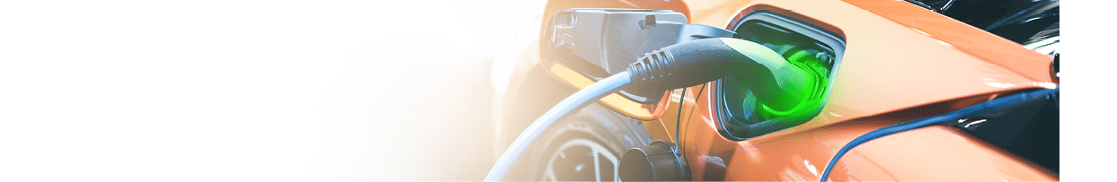 Electric EV car orange charge battery energy in the station. Panoramic web banner on white background with copy space concept.